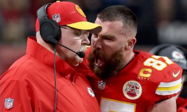 Travis Kelce shouts at head coach Andy Reid on the sideline during Super Bowl LVIII.