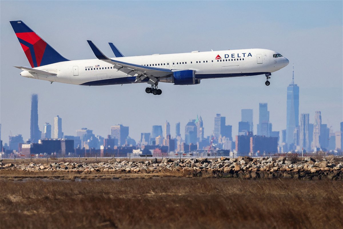 <i>Charly Triballeau/AFP/Getty Images</i><br/>A Boeing jet arriving at New York's John F. Kennedy Airport. Employees at Delta will get profit sharing equal to about 10% of their annual pay