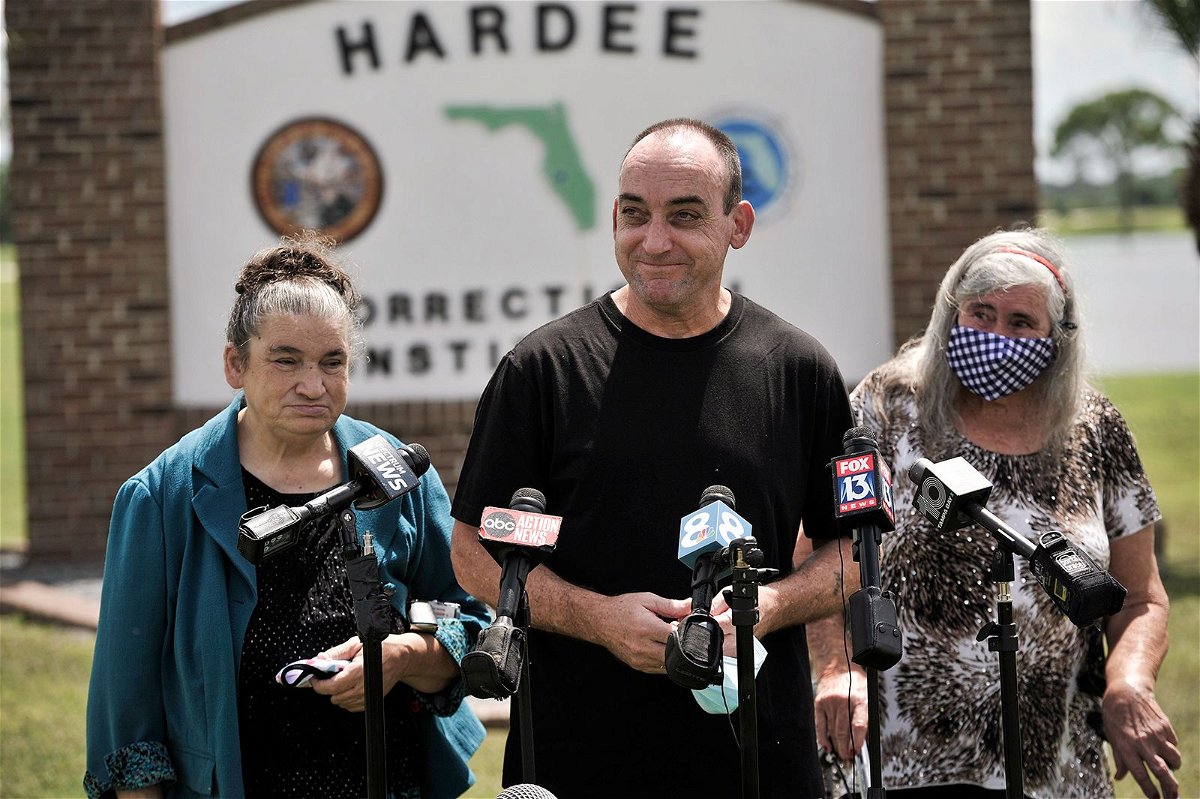 On August 27, 2020, former inmate Robert DuBoise, 56, meets reporters with his sister Harriet, left, and mother Myra, right, outside the Hardee County Correctional Institute after serving 37 years in prison, when officials discovered new evidence that proved his innocence in Hardee County, Florida.