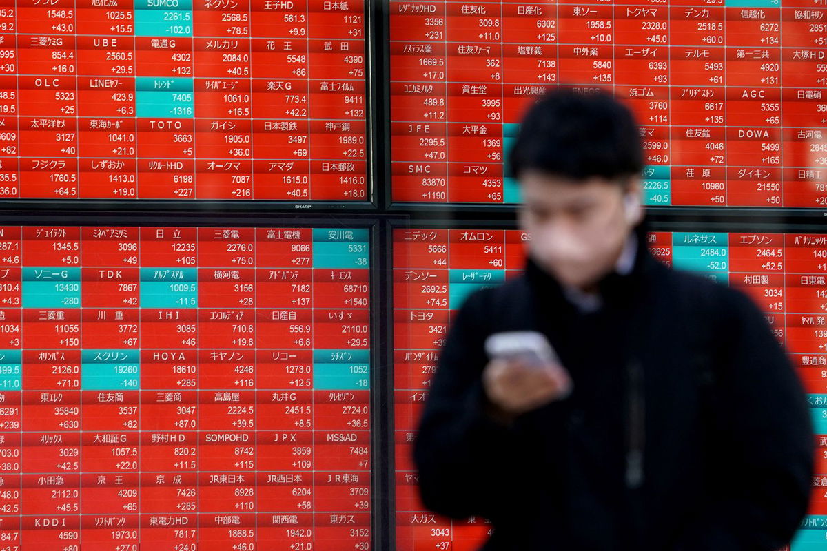 An electronic board displaying stock prices of companies listed on the Tokyo Stock Exchange shows rises for most shares on February 16, 2024.