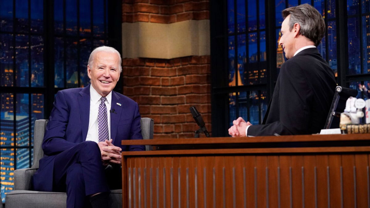 <i>Lloyd Bishop/NBC via Getty Image via CNN Newsource</i><br/>President Joe Biden talks with host Seth Meyers on February 26