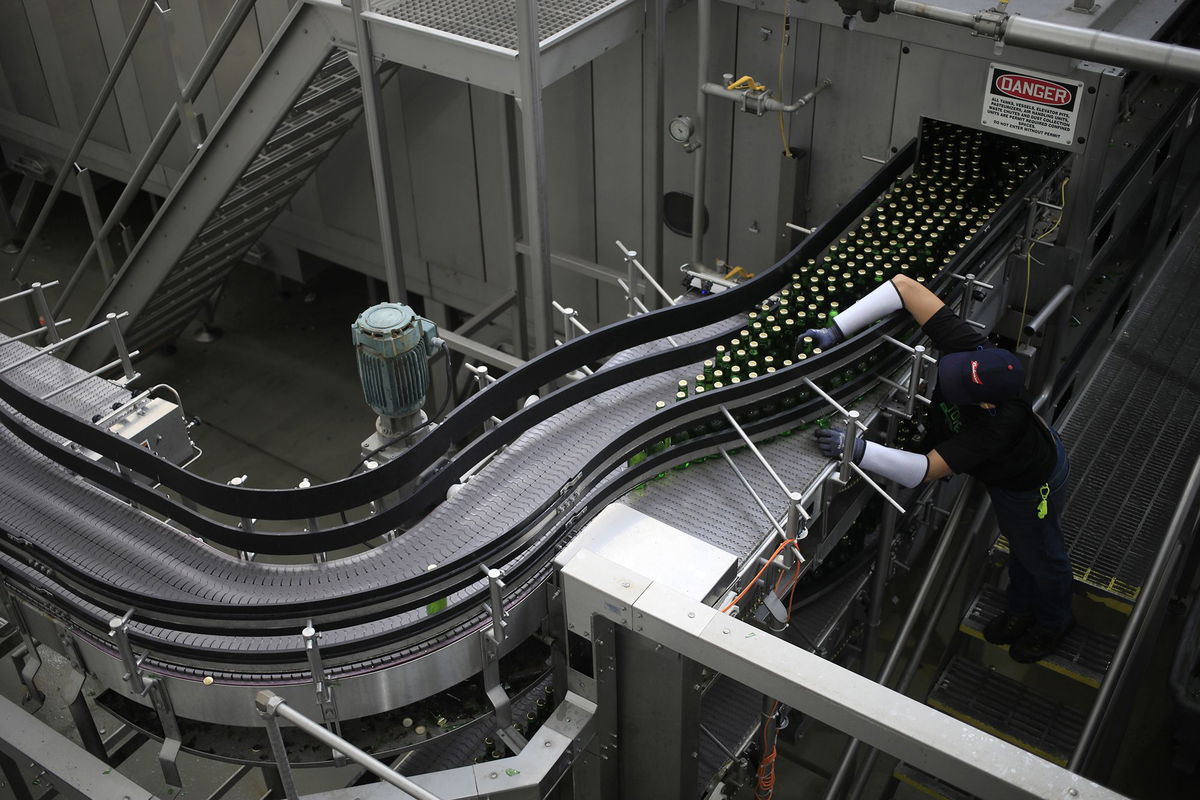 <i>Luke Sharrett/Bloomberg/Getty Images via CNN Newsource</i><br/>Bottles of Stella Artois brand beer move along the production line at the Anheuser-Busch Budweiser bottling facility in St. Louis