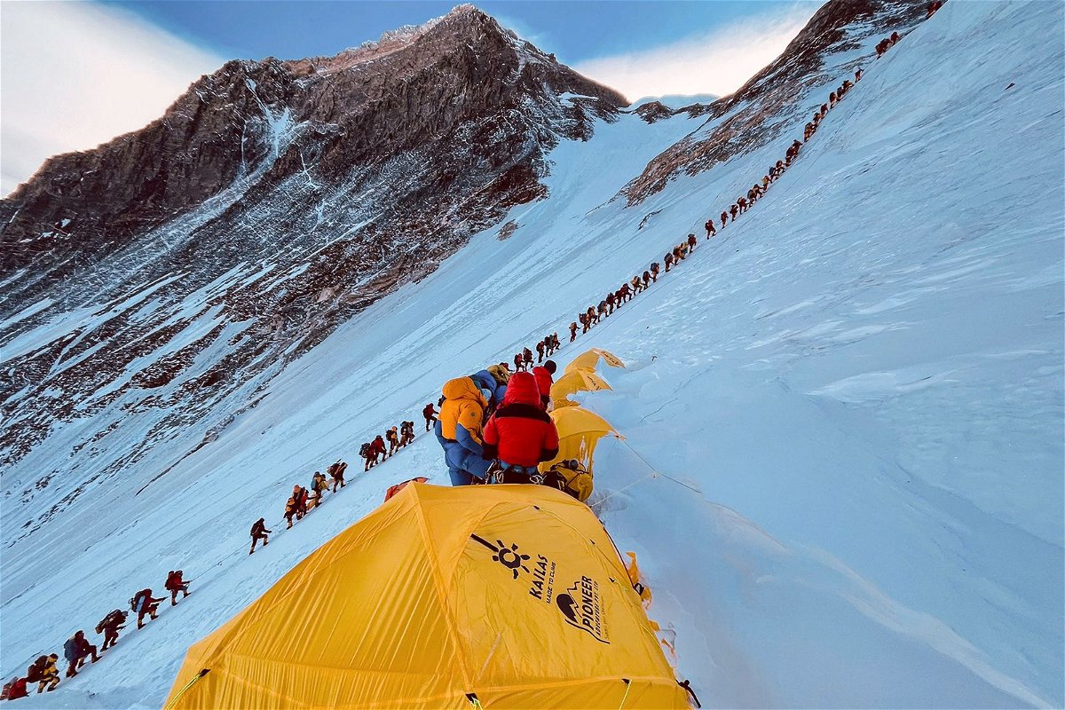 <i>Lakpa Sherpa/AFP/Getty Images/File via CNN Newsource</i><br/>This photograph from 2021 shows mountaineers lined up as they climb a slope during their ascent to summit Mount Everest.