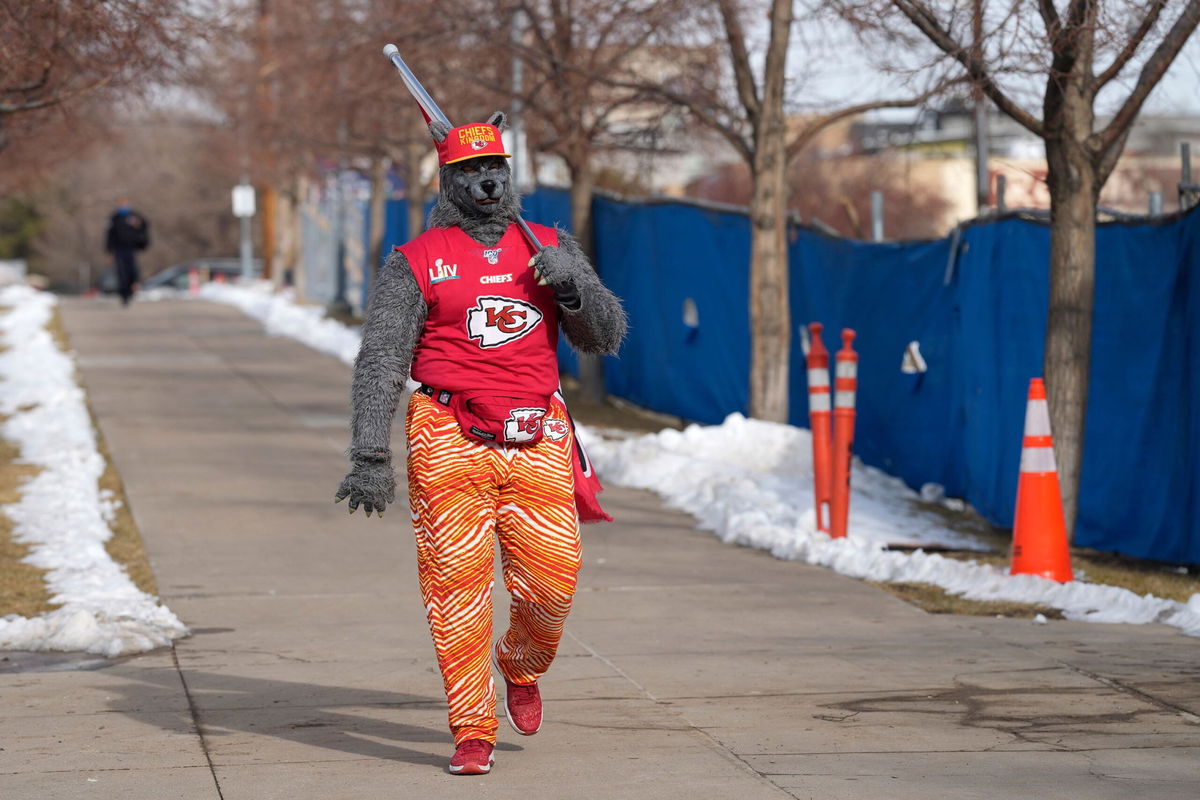 <i>David Zalubowski/AP via CNN Newsource</i><br/>The Kansas City fan known as ChiefsAholic walks in January 2022 toward Empower Field at Mile High in Denver.