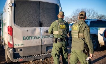 A federal judge suspended a controversial law that allowed state law enforcement agents to arrest and detain people they suspect of entering the country illegally. Border Patrol officers are shown here processing a group of about 60 migrants near the highway on February 4