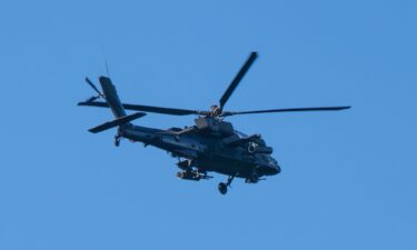 General view of an Apache helicopter flying over the Los Angeles South Bay area on February 11 in Los Angeles