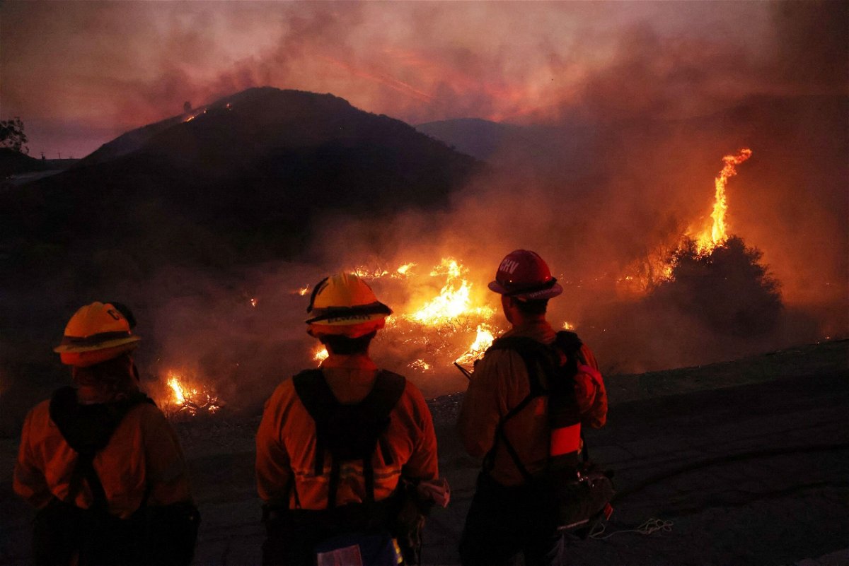 Firefighters are pictured here in Moreno Valley, Riverside County, California in July 2023. A study of more than 7 million people who lived close to large wildfires in California found that the fires are associated with big changes in mental well-being.