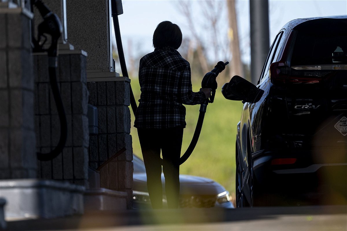 A customer pumps gas at a gas station in Hercules, California, on Thursday, March 14.
