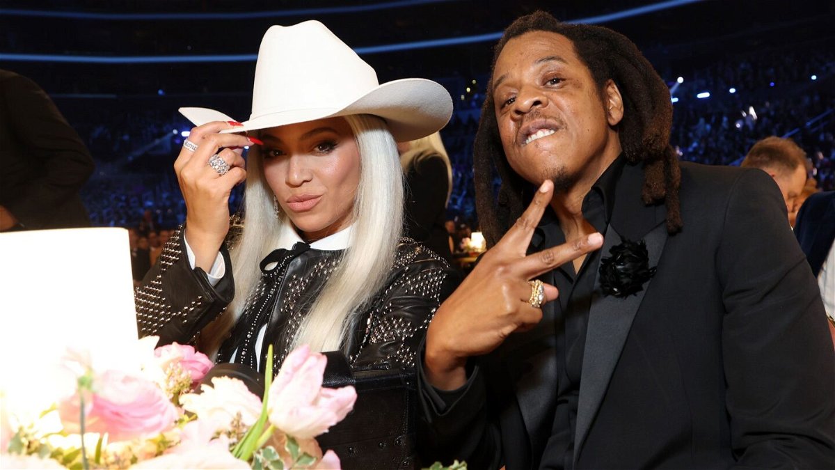 <i>Kevin Mazur/Getty Images via CNN Newsource</i><br/>Beyoncé and Jay-Z are pictured at the 2024 Grammy Awards in Los Angeles. Beyoncé said that her latest project “was born out of an experience that I had years ago where I did not feel welcomed…and it was very clear that I wasn’t.”