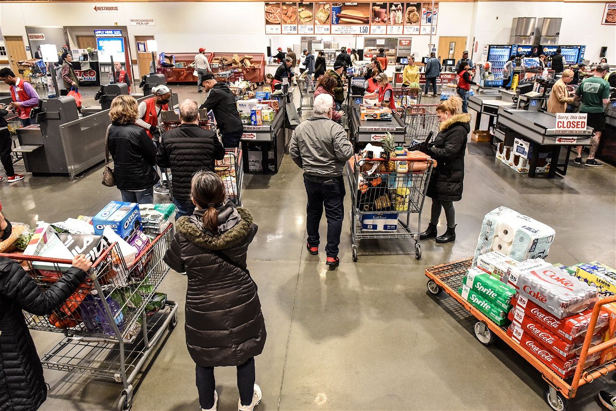 Customers check out at a Costco store in Teterboro, New Jersey, on February 28.