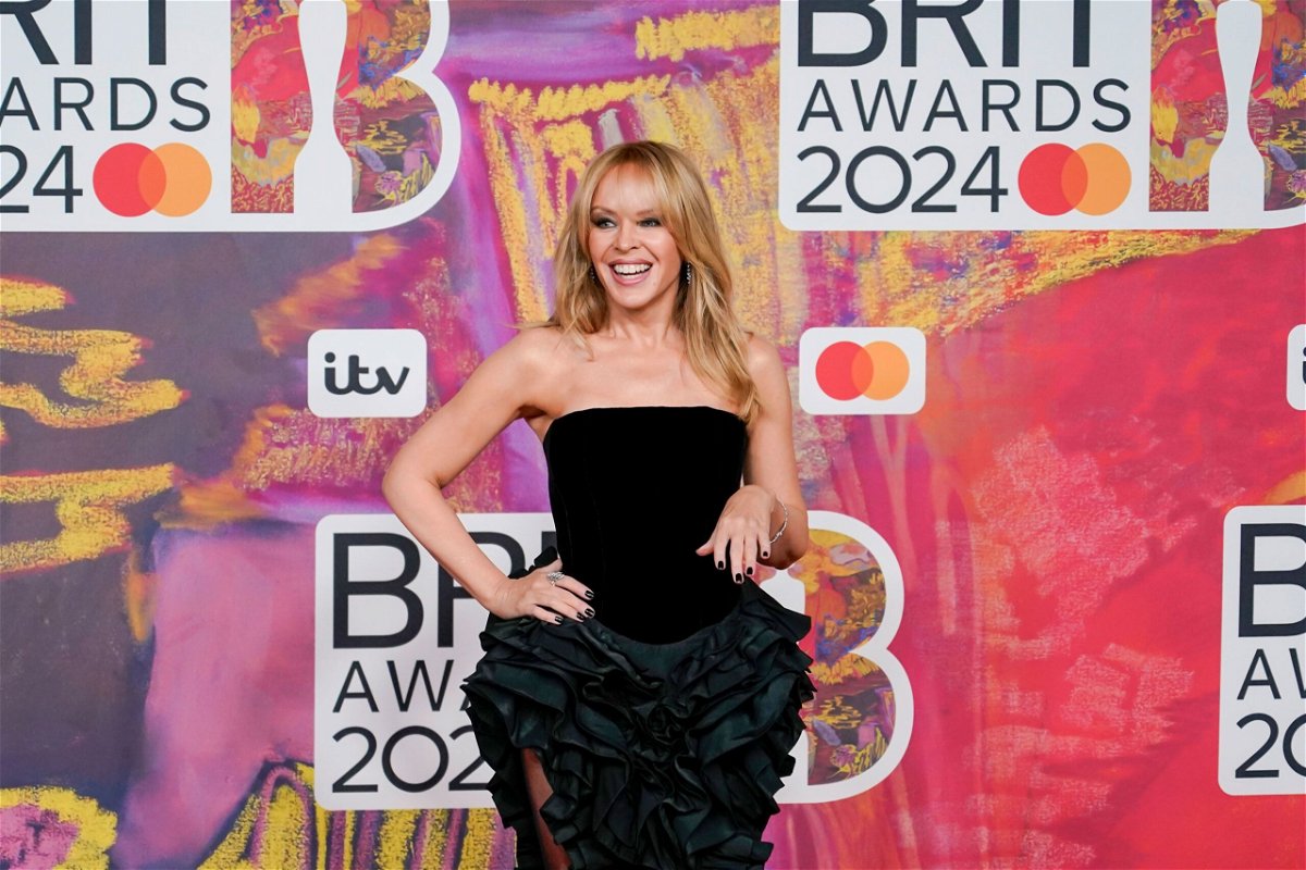 <i>Alberto Pezzali/Invision/AP via CNN Newsource</i><br/>Kylie Minogue poses for photographers upon arrival at the Brit Awards 2024 in London