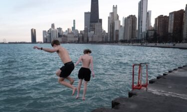 Kids jump into Lake Michigan during unseasonably warm conditions in Chicago on February 26.
