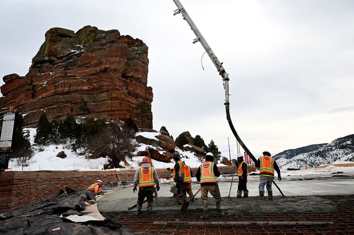 <i>Helen H. Richardson/MediaNews Group/The Denver Post/Getty Images via CNN Newsource</i><br/>Construction workers pour concrete in the upper parking lot at Red Rocks Park and Amphitheatre on February 6