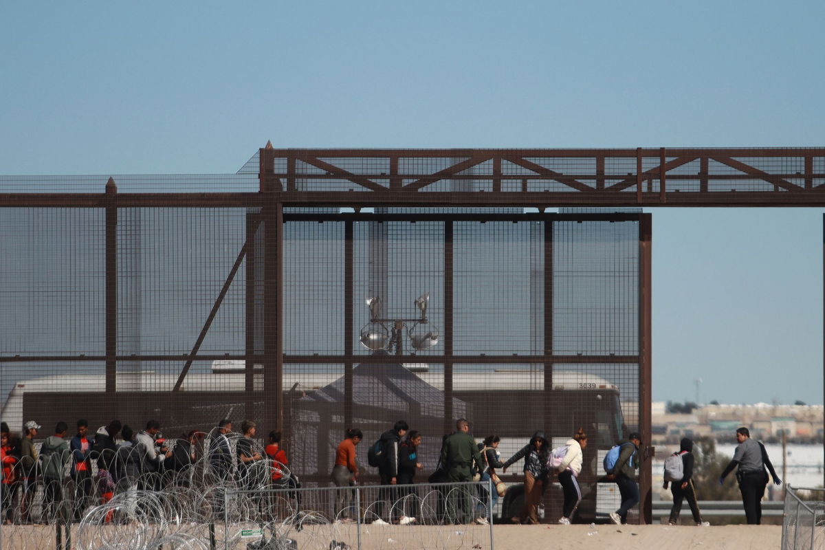 <i>Christian Torres/Anadolu/Getty Images via CNN Newsource</i><br/>Groups of migrants of different nationalities arrive at the Rio Grande