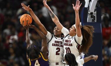 Cardoso holds a towel to her lip after an altercation against LSU.