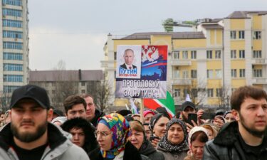 Commuters travel on a themed metro train dedicated to the upcoming presidential election in Moscow on February 27. The slogan reads: "Together we are a force - vote for Russia!"