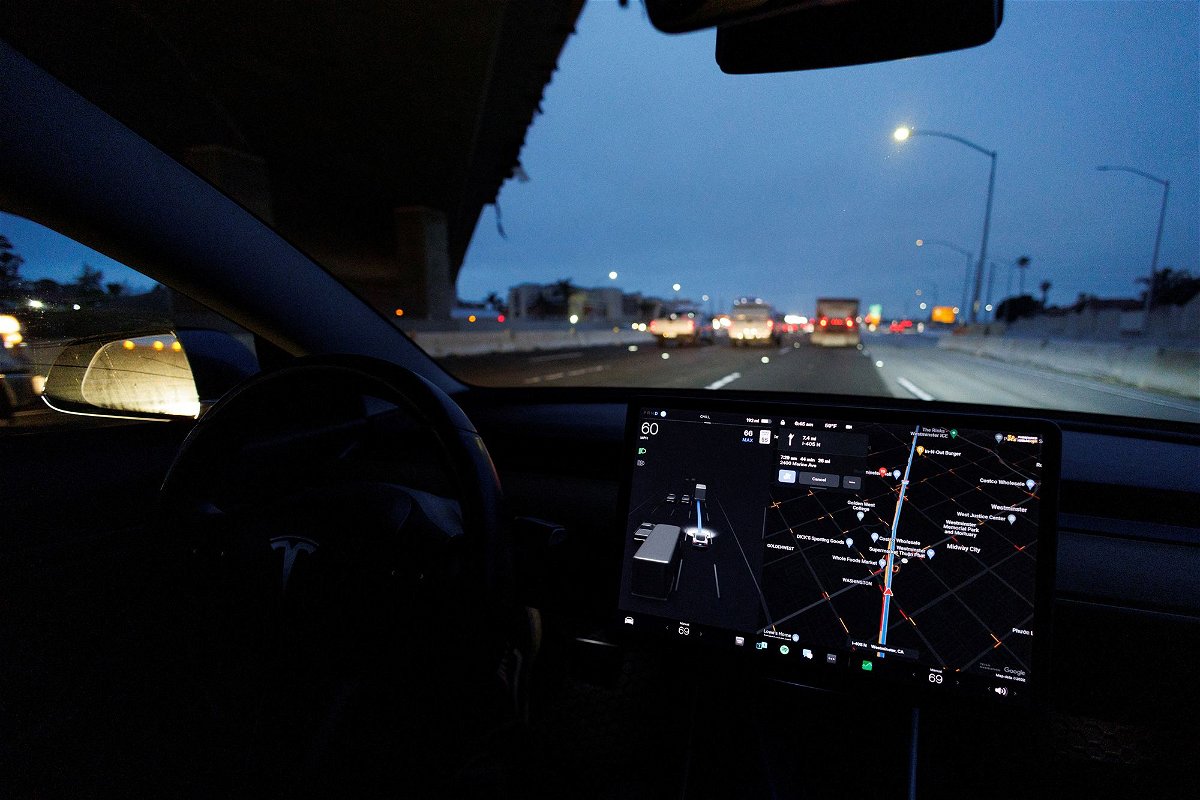 A Tesla Model 3 vehicle drives on autopilot along the 405 highway in Westminster, California, March 16, 2022.