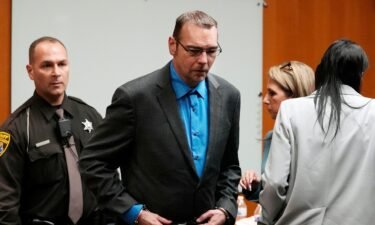 James Crumbley is escorted out of the Oakland County courtroom Friday in Pontiac