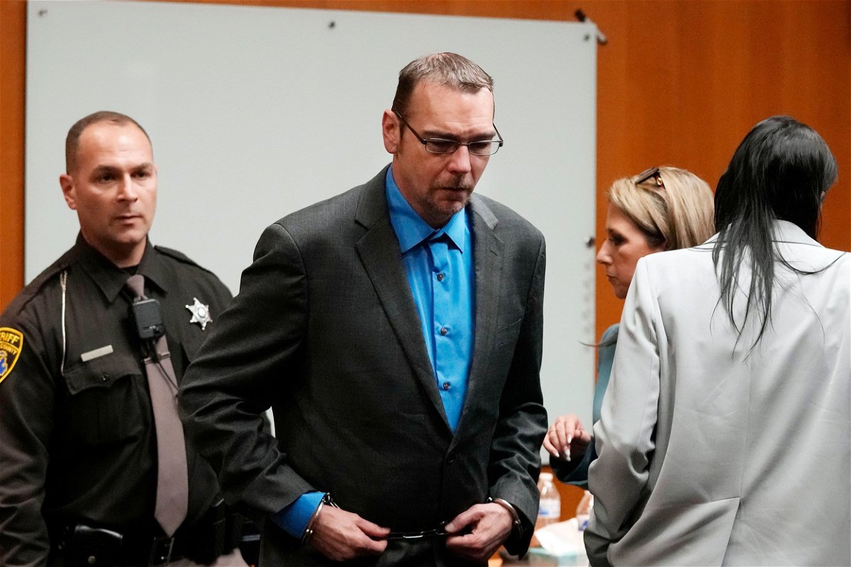 <i>Carlos Osorio/Pool/AP via CNN Newsource</i><br/>James Crumbley is escorted out of the Oakland County courtroom Friday in Pontiac