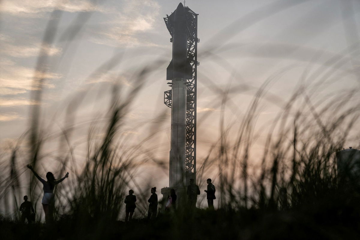 <i>Cheney Orr/Reuters via CNN Newsource</i><br/>Spectators gather on March 13 as SpaceX's next-generation Starship spacecraft is prepared for a third launch from the company's Boca Chica launchpad on an uncrewed test flight