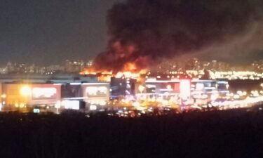 Smoke rises above the burning Crocus City Hall concert venue following a reported shooting and blast in the outskirts of Moscow