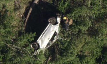 Los Angeles County firefighters rescued a driver after their vehicle plunged 400 feet down a cliff in the Angeles National Forest.