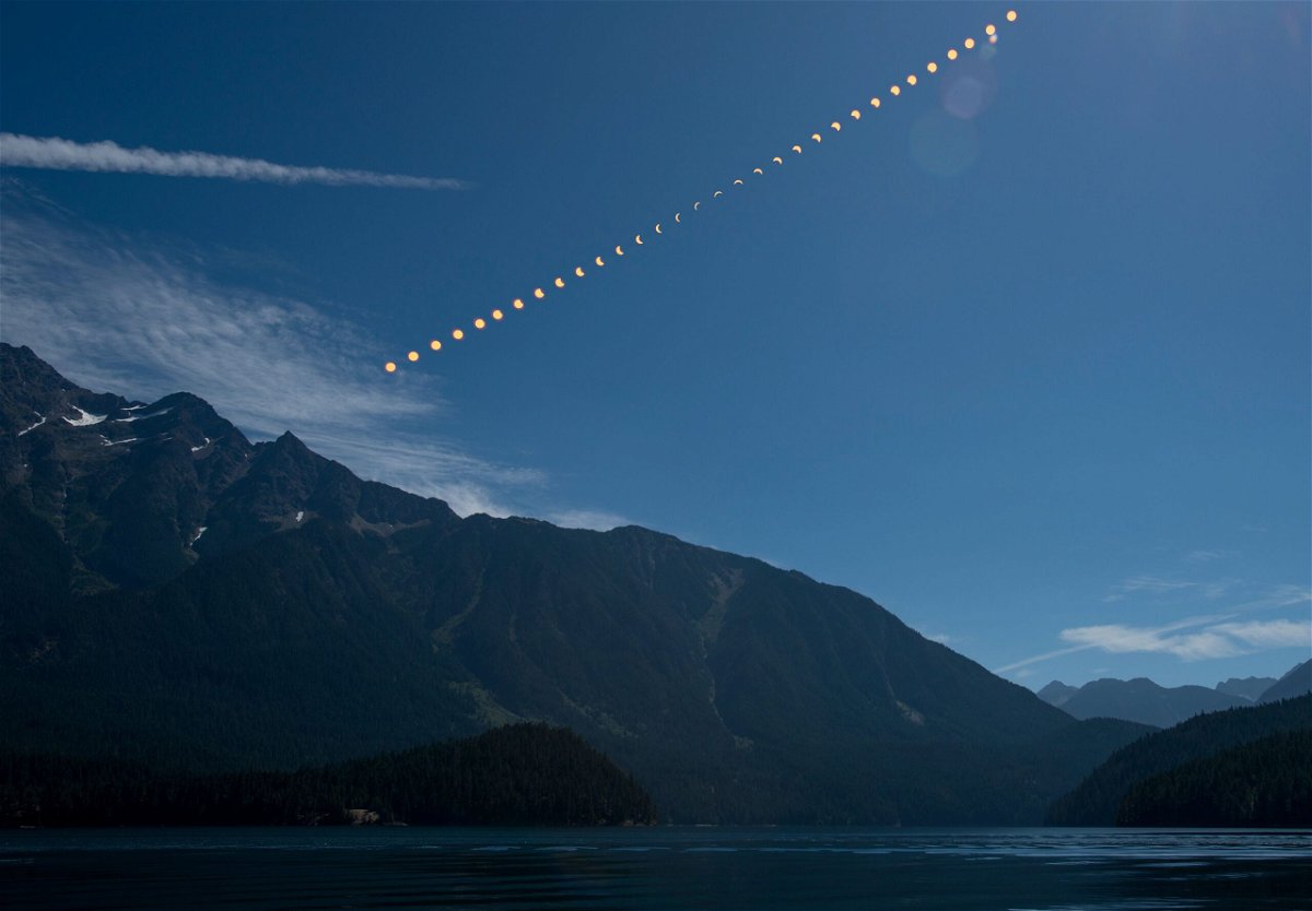This composite image shows the progression of a partial solar eclipse over Ross Lake in Northern Cascades National Park in Washington on August 21, 2017.