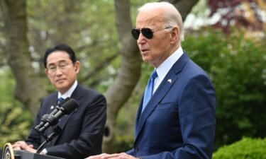 US President Joe Biden (R) and Japanese Prime Minister Fumio Kishida hold a joint press conference in the Rose Garden of the White House in Washington