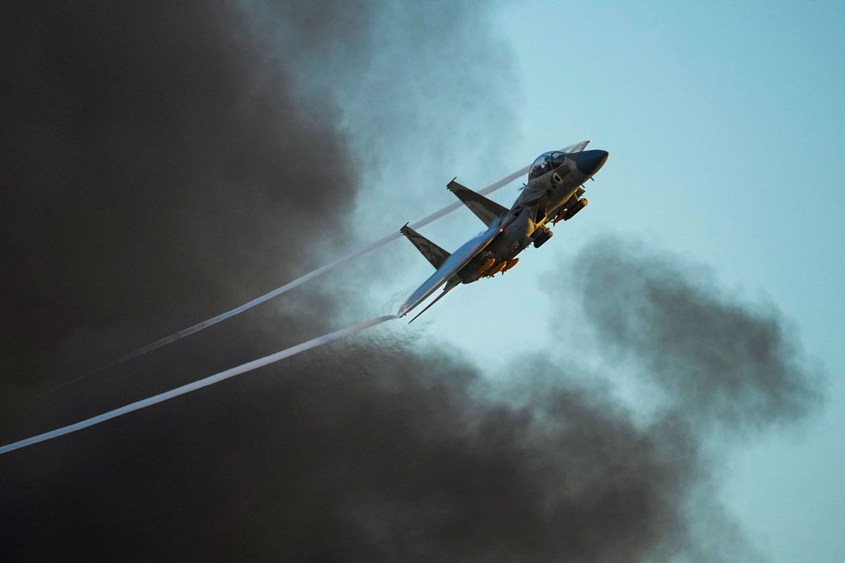 <i>Tsafrir Abayov/AP via CNN Newsource</i><br/>An Israeli air force F-15 war plane flies near the southern Israeli city of Beersheba