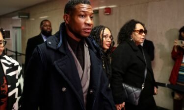 Actor Jonathan Majors arrives with Meagan Good for the jury selection in his assault and harassment case at Manhattan Criminal Court in New York City on December 18