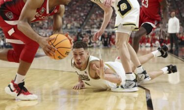 Mason Gillis dives after a loose ball in the second half of the Final Four game against North Carolina State.