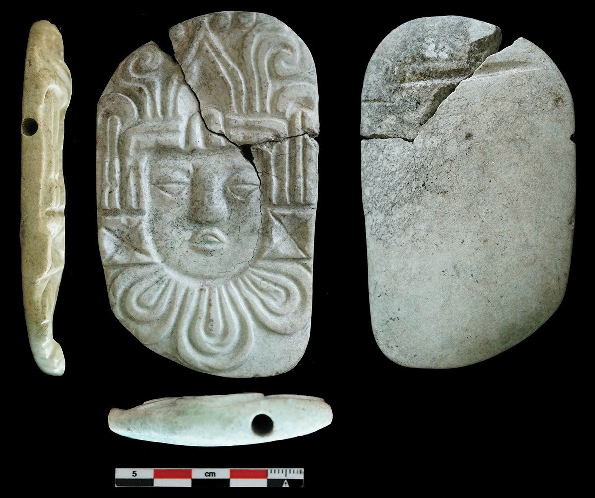 <i>C. Halperin/Courtesy Antiquity via CNN Newsource</i><br/>Burned grave goods found in a Maya pyramid with the royal bones included a carved pendant plaque of a human head.