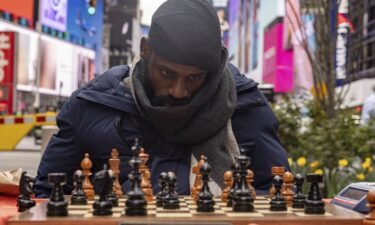 People celebrate as Tunde Onakoya marks 46 hours for consecutively playing a chess game in Times Square