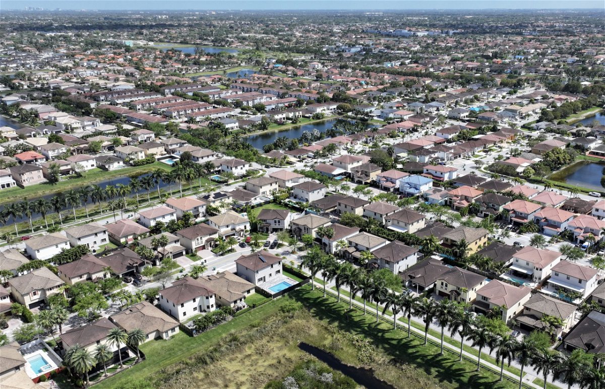 The current real estate business model is poised for a dramatic change. Homes sit on lots in a residential neighborhood on March 15, in Miami, Florida.