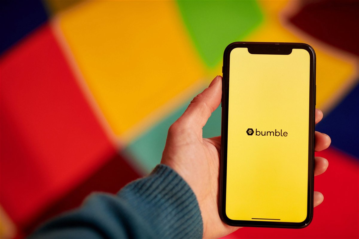 <i>Gabby Jones/Bloomberg/Getty Images via CNN Newsource</i><br/>The Bumble logo shown on a smartphone. Bumble is doing away with the requirement that women message potential matches first.