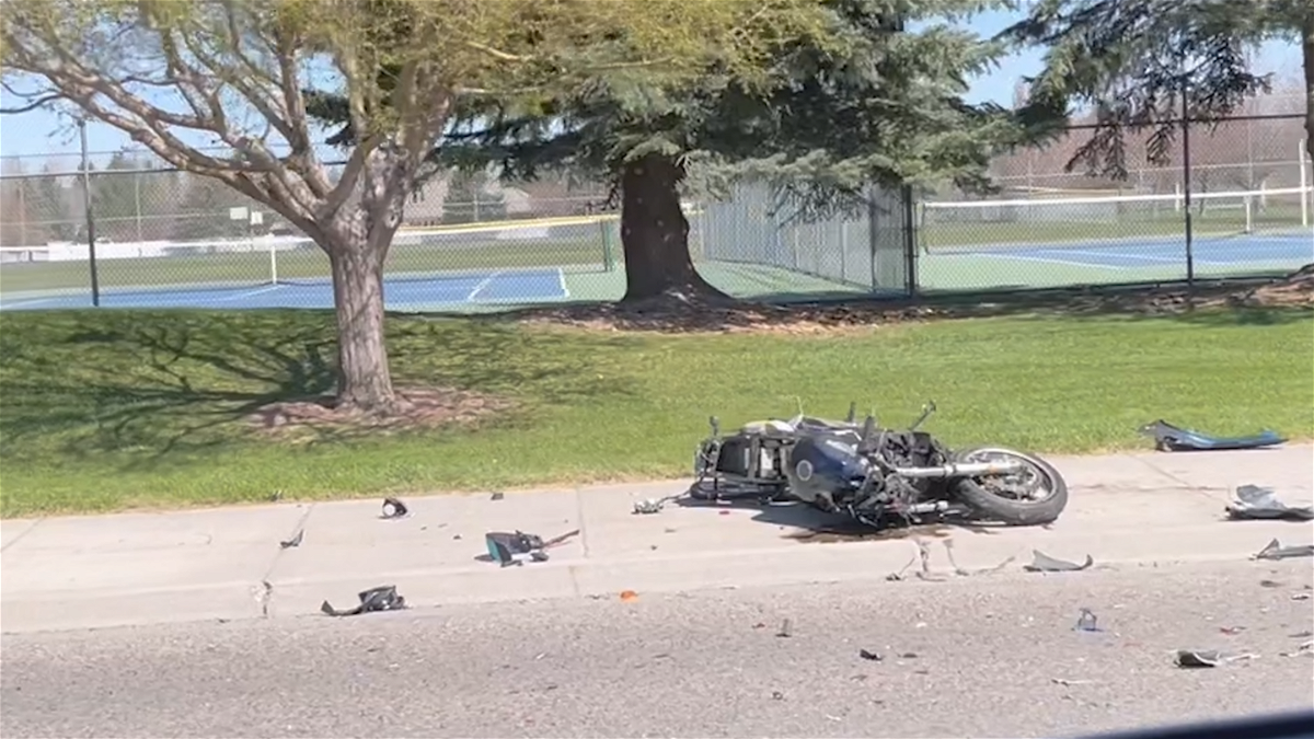 A motorcycle lays on the sidewalk along Sunnyside Road in Idaho Falls on April 19, 2024. 