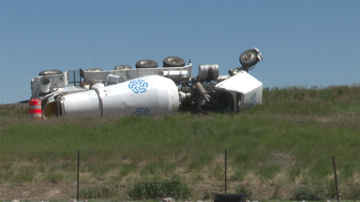 A cement truck is tipped over on US 20 off-ramp at Holmes Ave. in Idaho Falls on May 31, 2024.