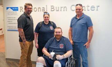 Milwaukee Firefighter Ryan McMenamin (seated) is joined