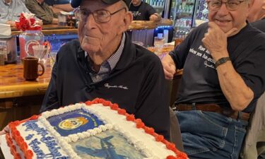 Reynolds Tomter gets a peek at his birthday cake.