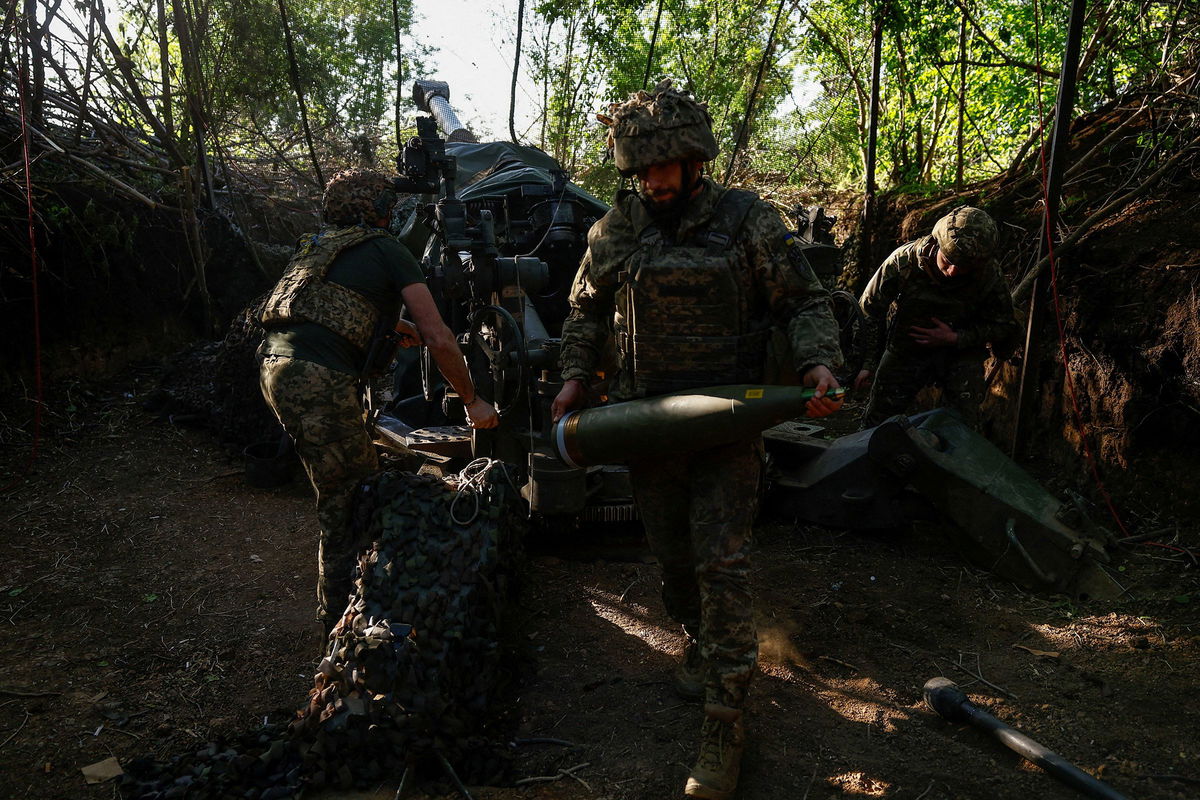 <i>Valentyn Ogirenko/Reuters via CNN Newsource</i><br/>Ukrainian servicemen fire a M777 howitzer toward Russian troops near a front line in the Donetsk region