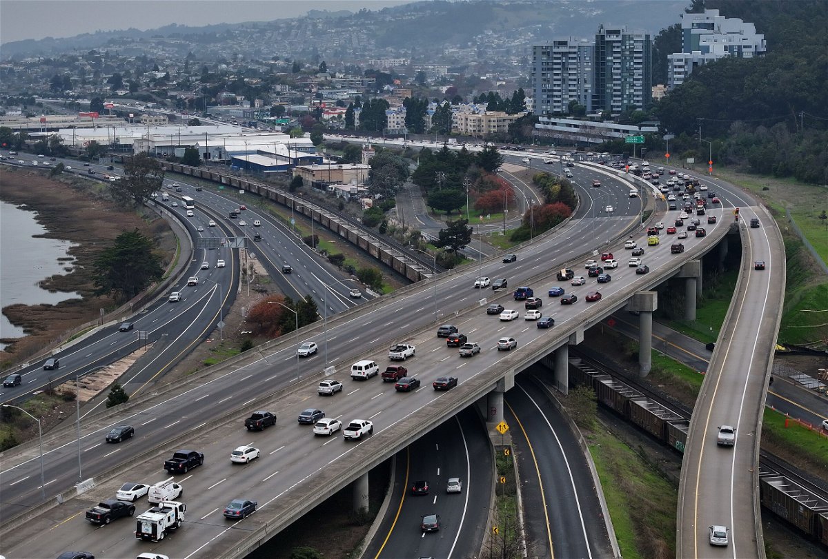 In an aerial view, cars travel along Interstate 80 on January 16 in Berkeley, California. According to a study by AAA, fixing sensors and cameras now accounts for more than a third of the post-crash repair costs in a new vehicle.