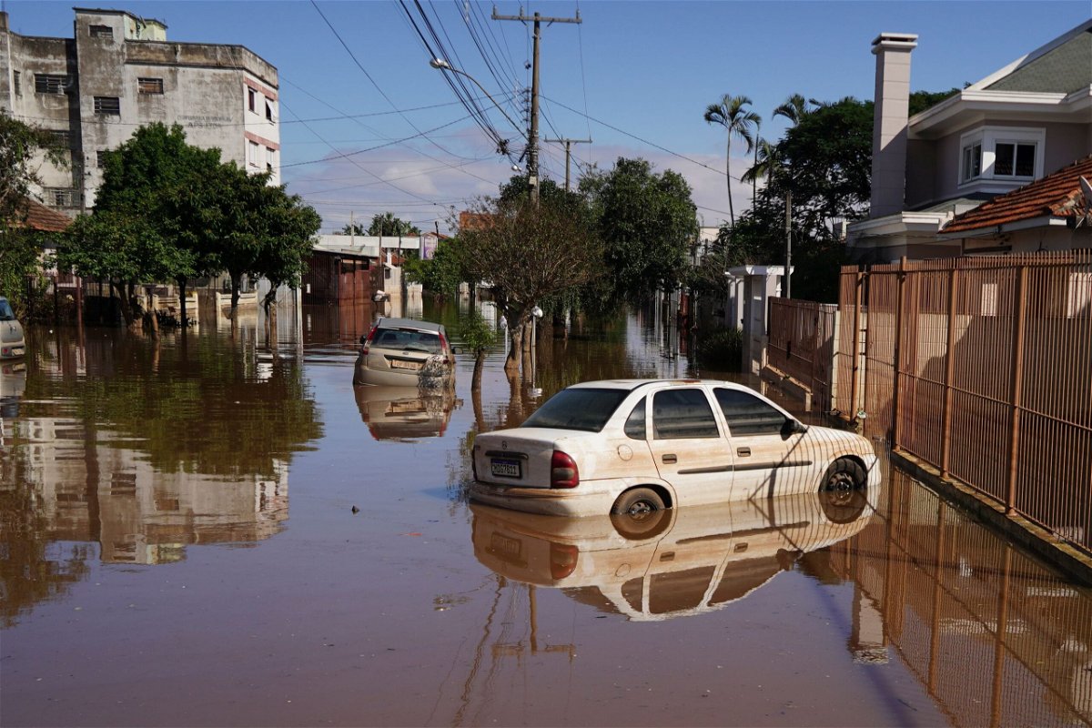 Cars are surrounded by flooded streets after heavy rain in Canoas, in Rio Grande do Sul state, on May 9.