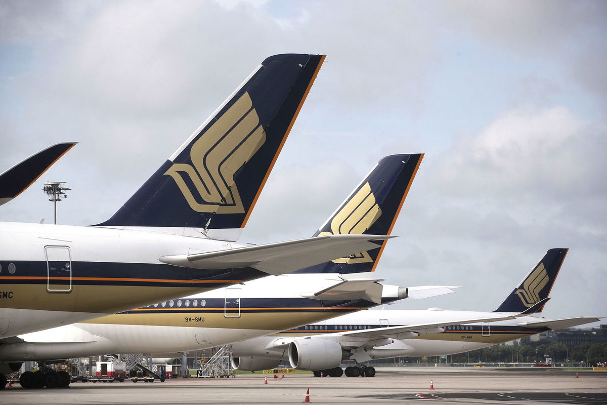 Singapore Airlines planes are seen here on a tarmac in December 2020. Singapore Airlines will reward its employees with a bonus worth nearly eight months of salary.