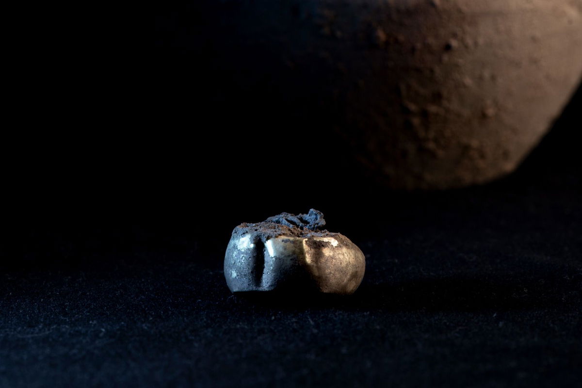 Archaeologists found a gold earring hidden inside a jar that had been placed in a wall at the Iron Age settlement called Tossal de Baltarga.