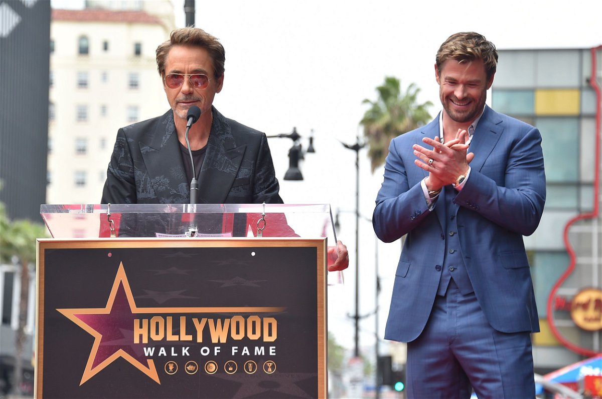 Robert Downey Jr., left, and Chris Hemsworth attend a ceremony honoring Hemsworth with a star on the Hollywood Walk of Fame on Thursday, May 23 in Los Angeles.
