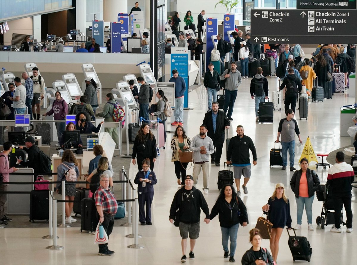 Passengers check in at San Francisco International Airport on May 24, 2024 in San Francisco, California. An estimated 43.8 million Americans will travel over Memorial Day weekend, a 4% increase from last year.