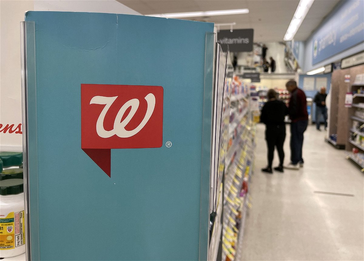 Customers shop at a Walgreens store in California. Walgreens is cutting prices on 1,500 items.