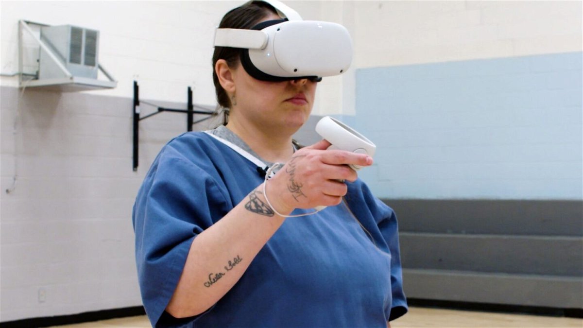 Tiffany Joseph Busch, an incarcerated woman at Maryland's Correctional Institution for Women, wears a virtual reality headset used for auto mechanic job training.	