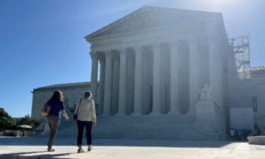 Visitors walk across the west plaza of the US Supreme Court on June 7