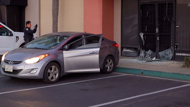 <i>KGTV via CNN Newsource</i><br/>The front door to a Miramar gun shop was smashed